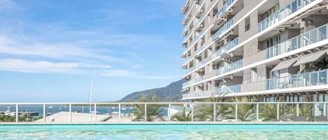Cool off with a dip in the glistening swimming pool, while taking in views across the harbour.