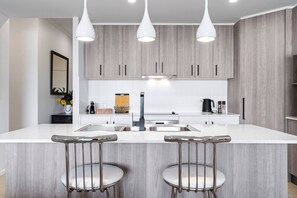 Start your mornings right with a comfortable and stylish chromium-plated high stool at the breakfast bar.