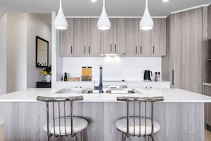 Start your mornings right with a comfortable and stylish chromium-plated high stool at the breakfast bar.