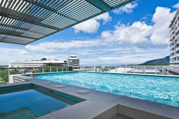 Cool off in the sparkling pool and spa, while taking in glimpses out toward the water. There's plenty of space to kick back.
