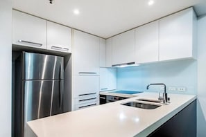 The gourmet kitchen is fully-equipped with the appliances and utensils you'll need to cook a meal at home.