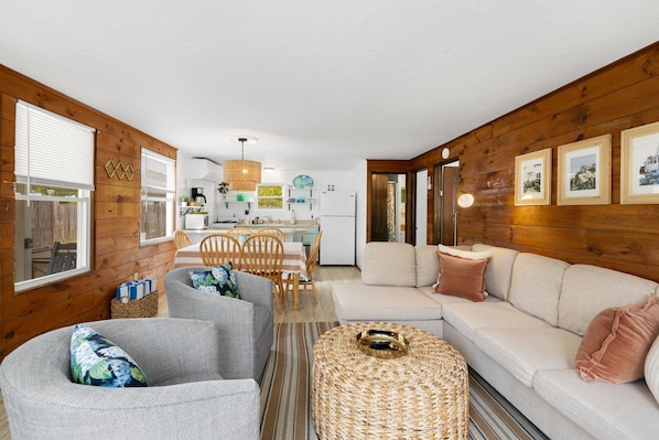 Complete with a dining table and a well-appointed kitchen