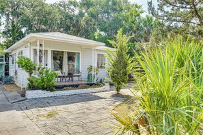 Cottage Exterior | Charcoal Grill | Partially Fenced Backyard
