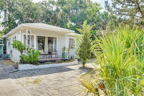 Cottage Exterior | Charcoal Grill | Partially Fenced Backyard