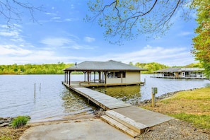 Simple Joys Await – A barefoot walk down the dock leads to adventure, peace, or both—depending on the day.