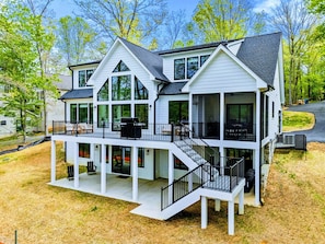 Modern Lakefront Elegance – Designed for relaxed luxury, this newly built retreat blends clean lines, natural light, and direct access to the water.