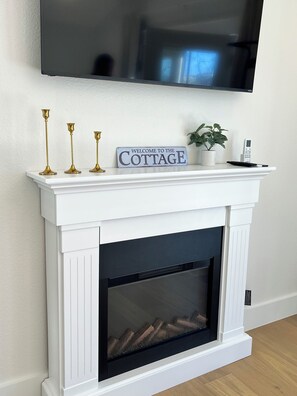 Electric fireplace - remote controlled with optional heat feature.