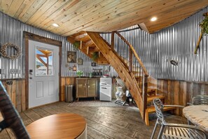 A vintage mini fridge and simple food prep area for snacks & morning coffee & tea. 2 outdoor communal propane grills with prep counters and utensils are available steps away from the silo. 