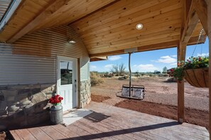 This cozy little silo is packed with character and thoughtful details to make you feel right at home. Pictured: parking behind the porch