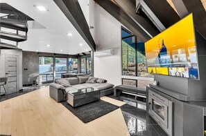 High glass windows that flood in the natural light, contemporary interior crafted by designers.