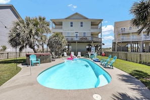 Cool off and relax in the private pool surrounded by palm trees—your own slice of paradise.