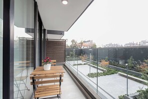 Relax on your private balcony with a charming view of the landscaped courtyard, perfect for morning coffee or evening relaxation.