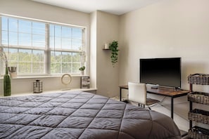 This serene queen suite features a smart Tv & ensuite
