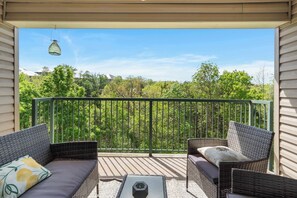 Lounge the day away with treetop views on the balcony