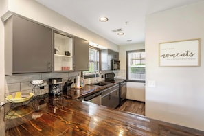 The inviting kitchen offers ample space & all the comforts of home