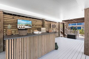The bar area is surrounded by comfortable seating, creating an inviting atmosphere for socializing or simply unwinding in style.