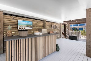 The bar area is surrounded by comfortable seating, creating an inviting atmosphere for socializing or simply unwinding in style.