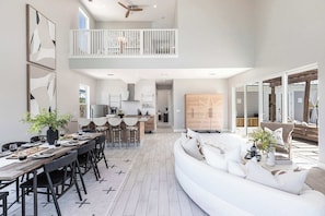 The open living and dining space creates an inviting and spacious atmosphere, perfect for gatherings and family time.
