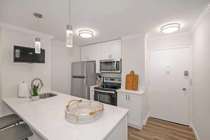 Full-size kitchen with a free standing fridge
