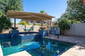 Shoot some hoops or soak in the shaded hot tub—this pool area has it all for fun and relaxation!