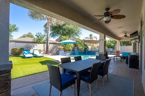 Dine al fresco with pool views and your favorite show playing on the outdoor TV—vacation mode: activated!