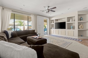 Whether you're lounging inside or heading out for a swim, this space keeps you connected to the backyard bliss.
