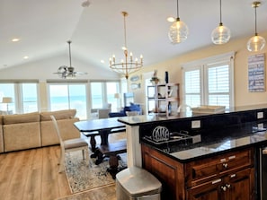 Livingroom, dining room and kitchen with great views.