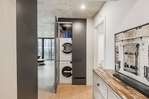 In-unit washer and dryer conveniently located near the entrance.