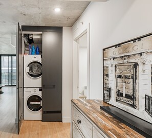 In-unit washer and dryer conveniently located near the entrance.