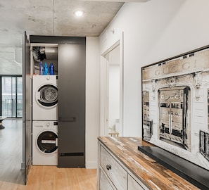 In-unit washer and dryer conveniently located near the entrance.