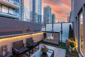 CT tower, fireplace, outdoor lighting and dining area.