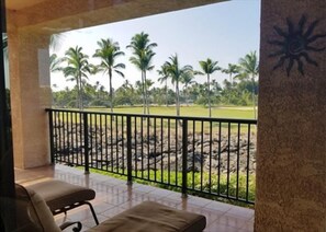 Unwind on your private lanai with loungers and an unbeatable view of swaying palms and lava rock.
