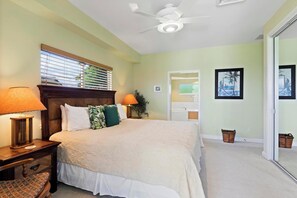 Escape to comfort in this serene suite with island accents and a cozy king size bed.