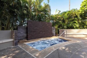 Melt your stress away in this secluded spa surrounded by beautiful greenery and soothing stonework.