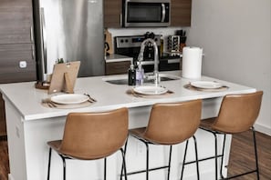 The dining room invites you to savor every moment, whether enjoying a quiet meal or hosting a festive gathering.