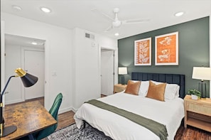 The bedroom offers a luxurious retreat, with a bed that promises restful nights and a room that feels like a private oasis.