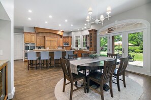 Great kitchen for entertaining with island counter seating and dining table