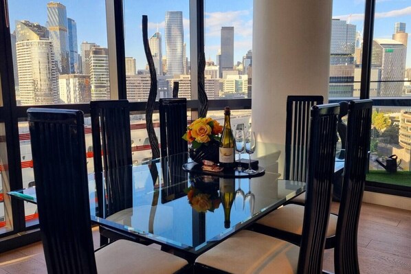 Luxuriously furnished 6 seater glass dining table with a marble base.