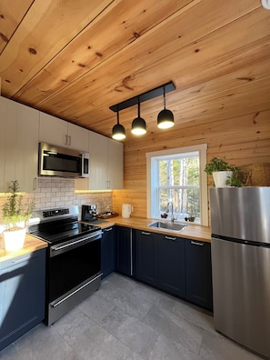 The kitchen is fully equipped with all essential appliances and cookware.