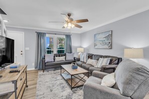 Living room. Sleeper sofa. Sleeps 2. Sand Dollar unit 5. 2 bedrooms. 1.5 bathrooms. Gulf Shores, AL 36542. Managed by Island Rentals.