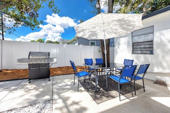 Private fenced outdoor area with grill