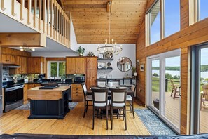Kitchen and Dining area with doors to the front deck