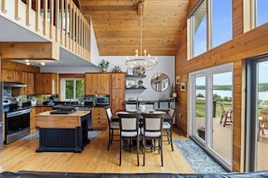 Kitchen and Dining area with doors to the front deck