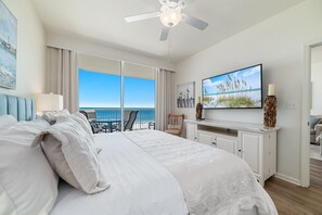 Wake up to stunning water views in this beautifully appointed master bedroom. Seamlessly blending indoor and outdoor living, the expansive sliding doors open to a private balcony, creating a serene and luxurious retreat.