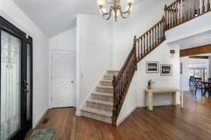 Front entryway with stairs that lead to the master suite.