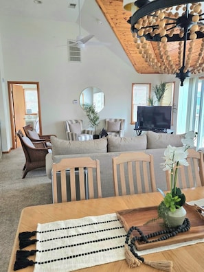 Great room with vaulted ceilings, 10 top table in dining room - third floor.