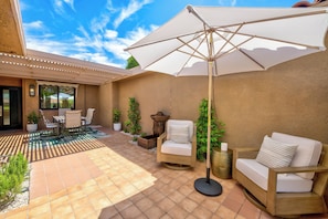 Private Courtyard with foundation, dining table and chairs