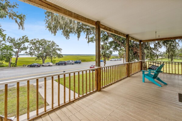 Your Front Porch with Seating and a Swing, Looks out at the St. Marys River and is the Perfect Spot for Peaceful Moments