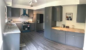 Full kitchen- Refrigerator & (Induction) Stove, pot and pan available