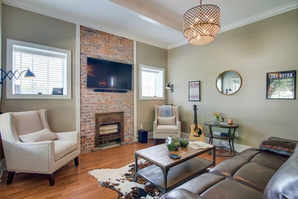 Kick back in the super comfy, spacious living room with a reclining sofa and a smart TV ready for streaming.
